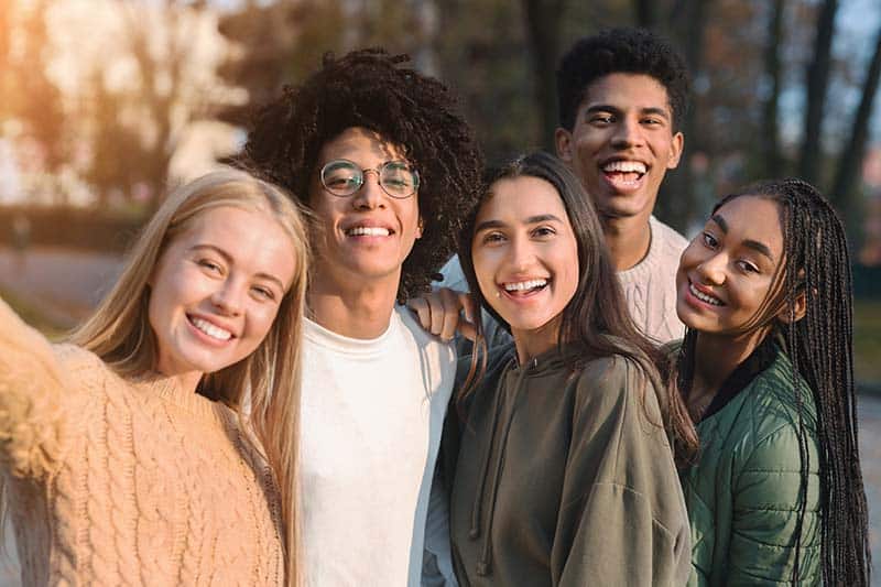 Happy group teenagers Invisalign for teens