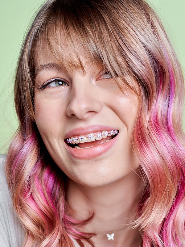 Teenage-Girl-Pink-Hair-Smiling-Showing-Off-Pink-Braces