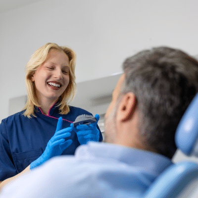 The evolution of orthodontics 3 Orthodontist explaining appliance technology to patient, representing orthodontics